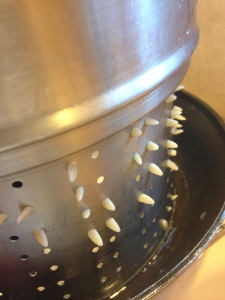 Orzos poking out of the strainer