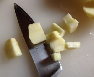 Chopping the fruit into 1 inch dice