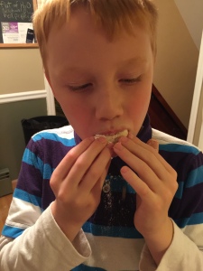 son eating cookie