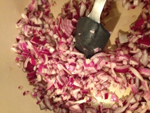 Cooking down the red onions