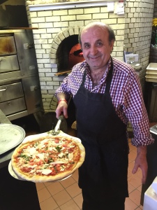 Our lovely host, Giovanni, putting a pizza into the brick oven